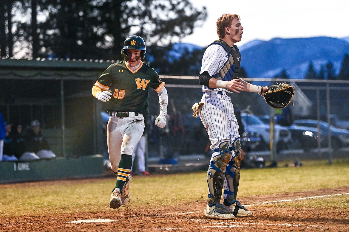 Whitefish's Christian Schwaderer crosses the plate in the fifth inning against Columbia Falls at Sapa-Johnsrud Memorial Field on Friday, April 4. (Casey Kreider/Daily Inter Lake)