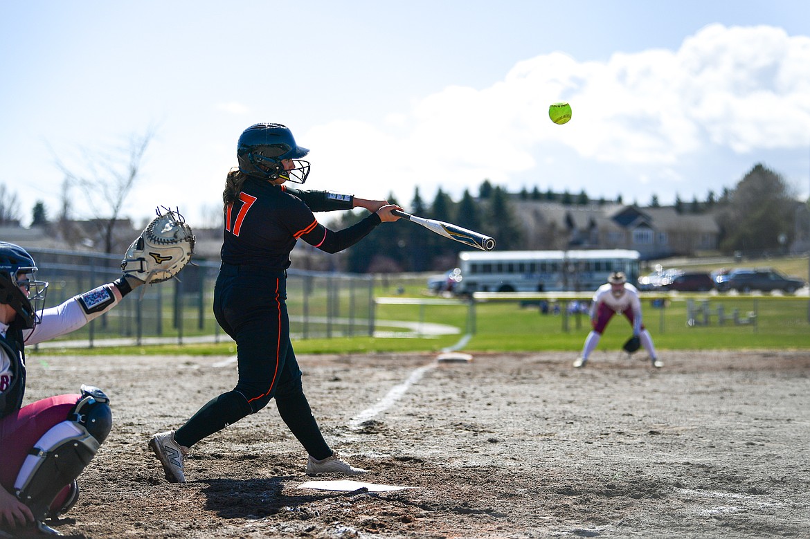Flathead's Reese Conley (17) connects on a triple against Helena at Kidsports Complex on Friday, April 4. (Casey Kreider/Daily Inter Lake)
