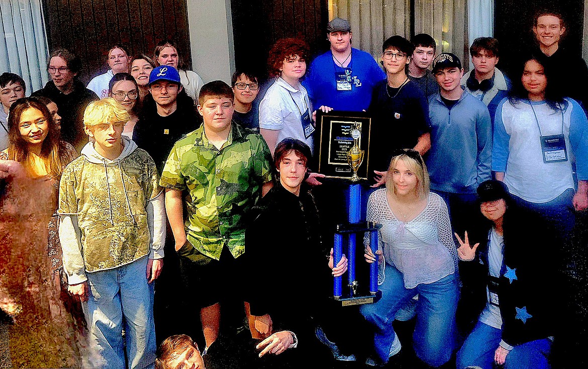 Libby Middle High School concert band members proudly display their trophies the Loggers won during their recent trip to Seattle, earning a Gold rating and second place overall among concert bands, in addition to the coveted Adjudicator Award at the WorldStrides Heritage Music Festival. (Courtesy photo)