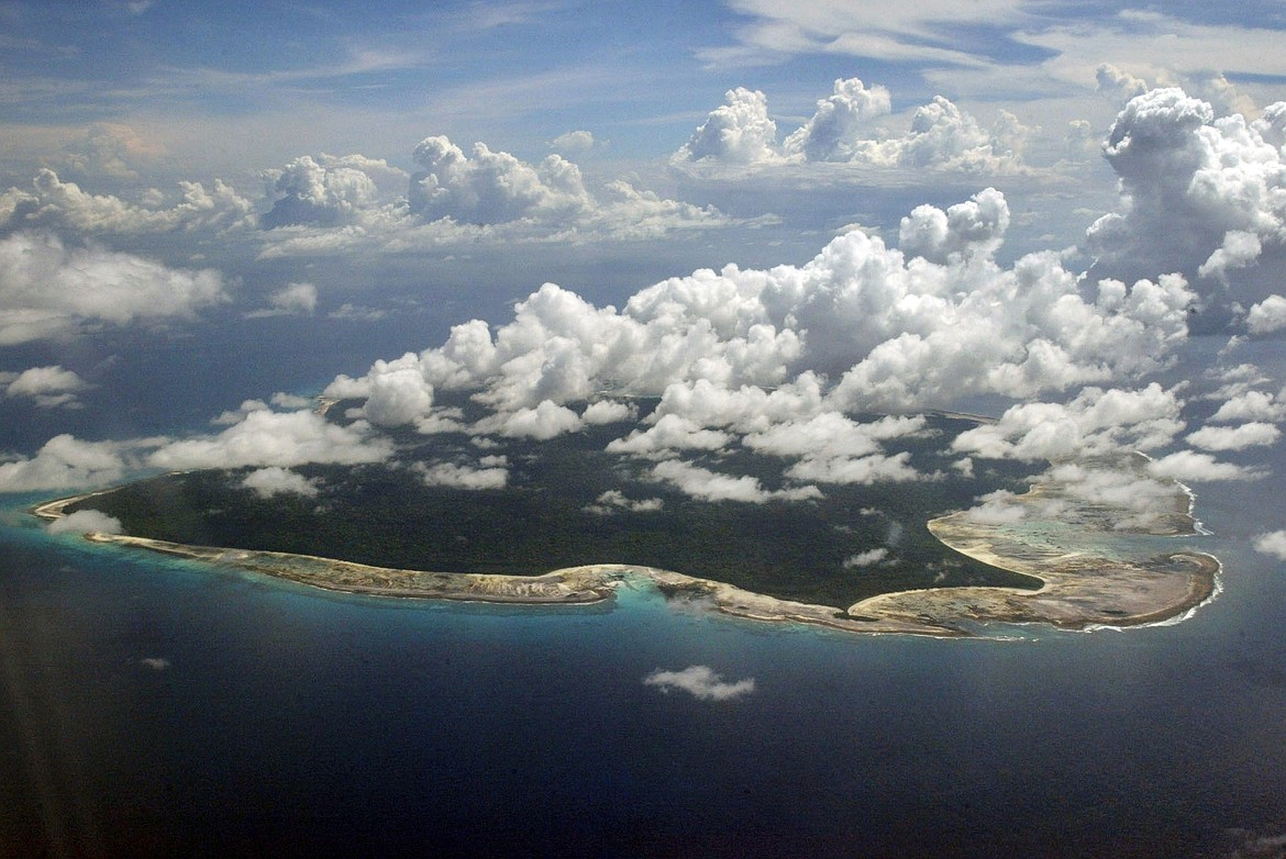 louds hang over the North Sentinel Island, in India's southeastern Andaman and Nicobar Islands, Nov. 14, 2005. (AP Photo/Gautam Singh, File)