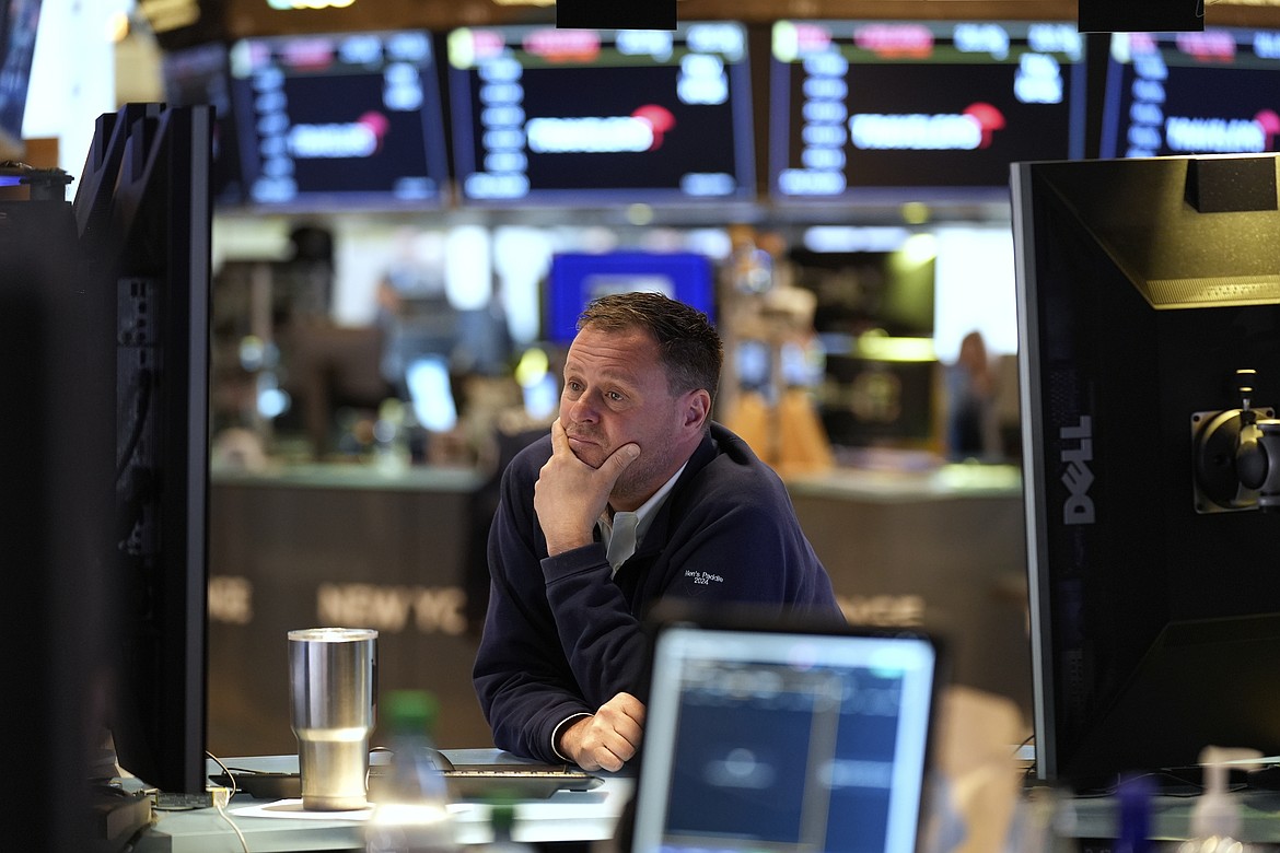 Traders work on the floor at the New York Stock Exchange in New York, Monday, April 7, 2025. (AP Photo/Seth Wenig)