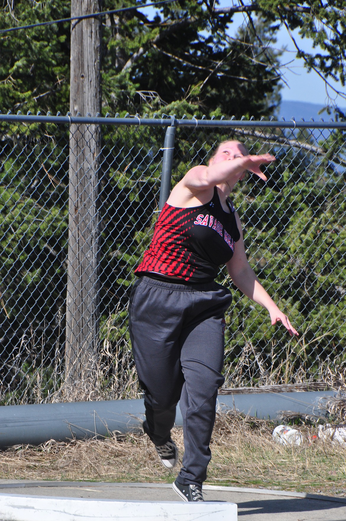 Hot Springs shot putter Georgia Uski gives the iron ball a heave during the Bigfork Invitational track meet this past Saturday.  (Photo by Sarah Naegeli)