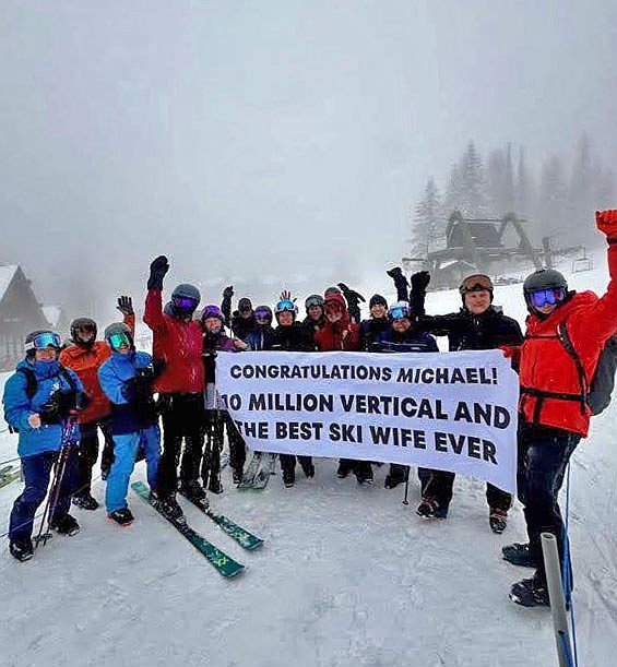 Friends gathered near Chair 4 to congratulate Michael Donnay on accomplishing his 10-million-foot vertical goal and give props to his wife, Kerith, who ranked 34th on the vert tracker. (Howie Nordstrom photo)