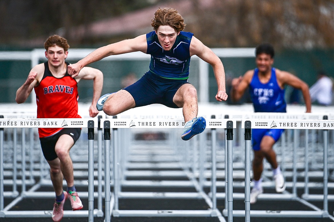 Glacier's Ethan Anderson clears a hurdle in the boys 100 meter hurdles at the Kalispell Time Trials at Legends Stadium on Tuesday, April 8. (Casey Kreider/Daily Inter Lake)