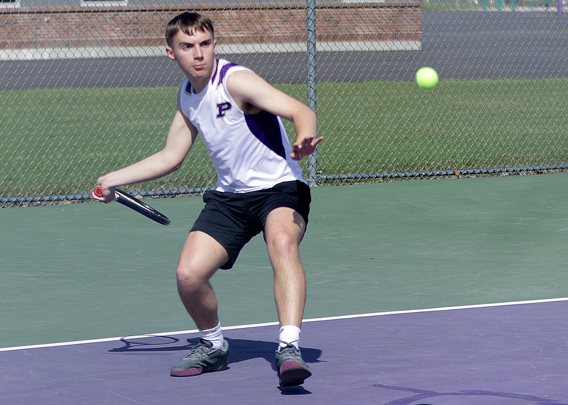 Junior Ruger Ellis prepares to hit the ball in a singles match versus Dillon. (Bob Gunderson photo)