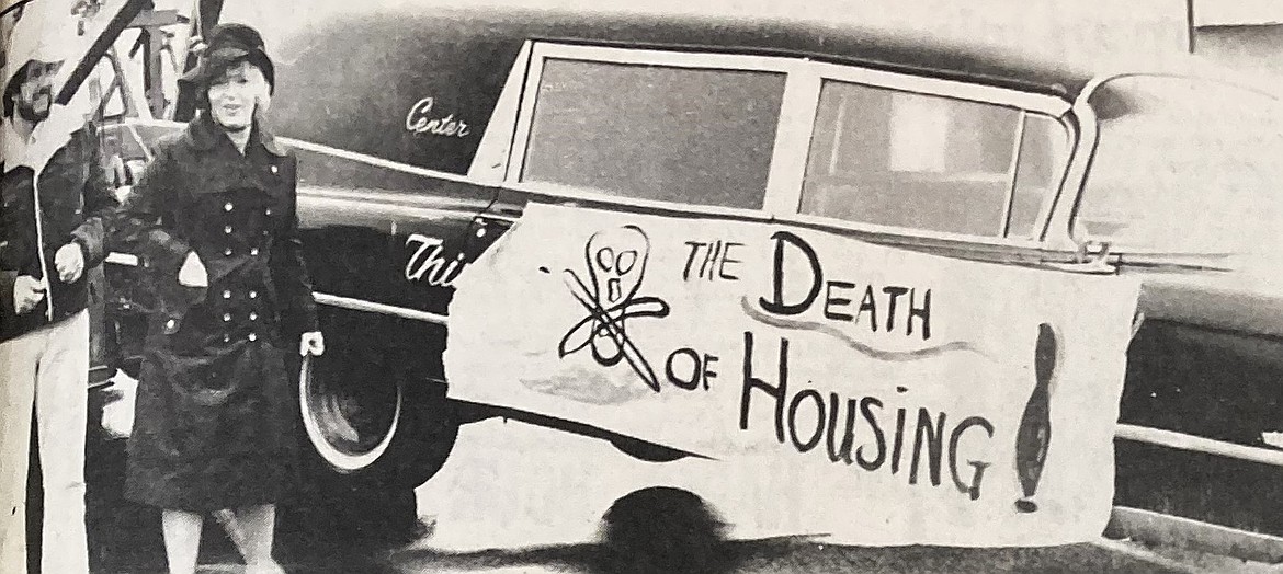 Dave Finkle and Evalyn Adams stand by a hearse before a 1980 protest parade.