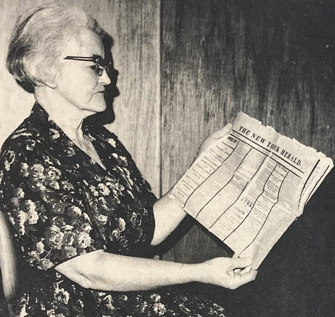 Mrs. William Miller with an 1865 copy of The New York Herald.