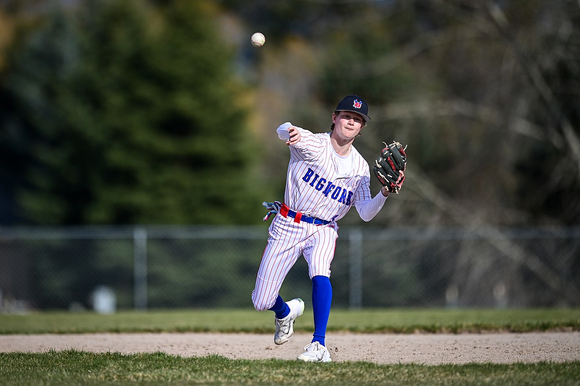 Bigfork shortstop Grady Campbell (3) throws to first for an out against Bigfork at ABS Park on Thursday, April 10. (Casey Kreider/Daily Inter Lake)
