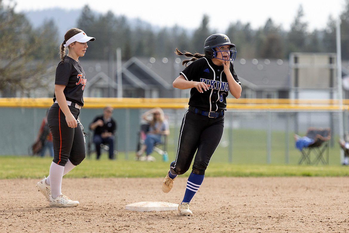 Courtesy photo
Coeur d'Alene senior Chloe Burke shows her emotion as she rounds second base after hitting her first high school home run in the first game of a doubleheader against Post Falls on Thursday at Coeur d'Alene High.