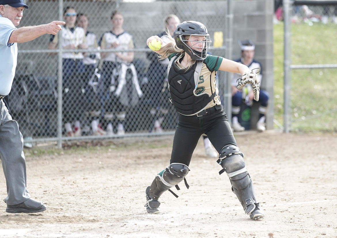 MARK NELKE/Press
St. Maries senior catcher Brenna Elliott throws to first for the out in the second game of a doubleheader against Timberlake in Spirit Lake.