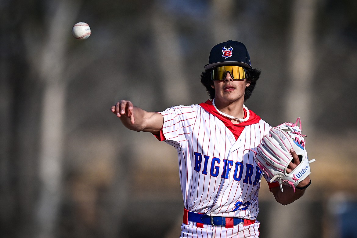 Bigfork second baseman Rye Rodriguez (23) throws to first for an out against Eureka at ABS Park on Thursday, April 10. (Casey Kreider/Daily Inter Lake)