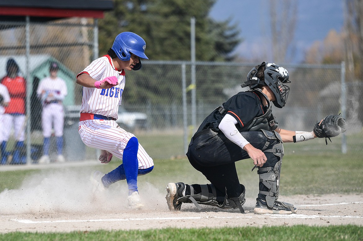 Bigfork's Rye Rodriguez (23) scores on a sacrifice fly against Eureka at ABS Park on Thursday, April 10. (Casey Kreider/Daily Inter Lake)