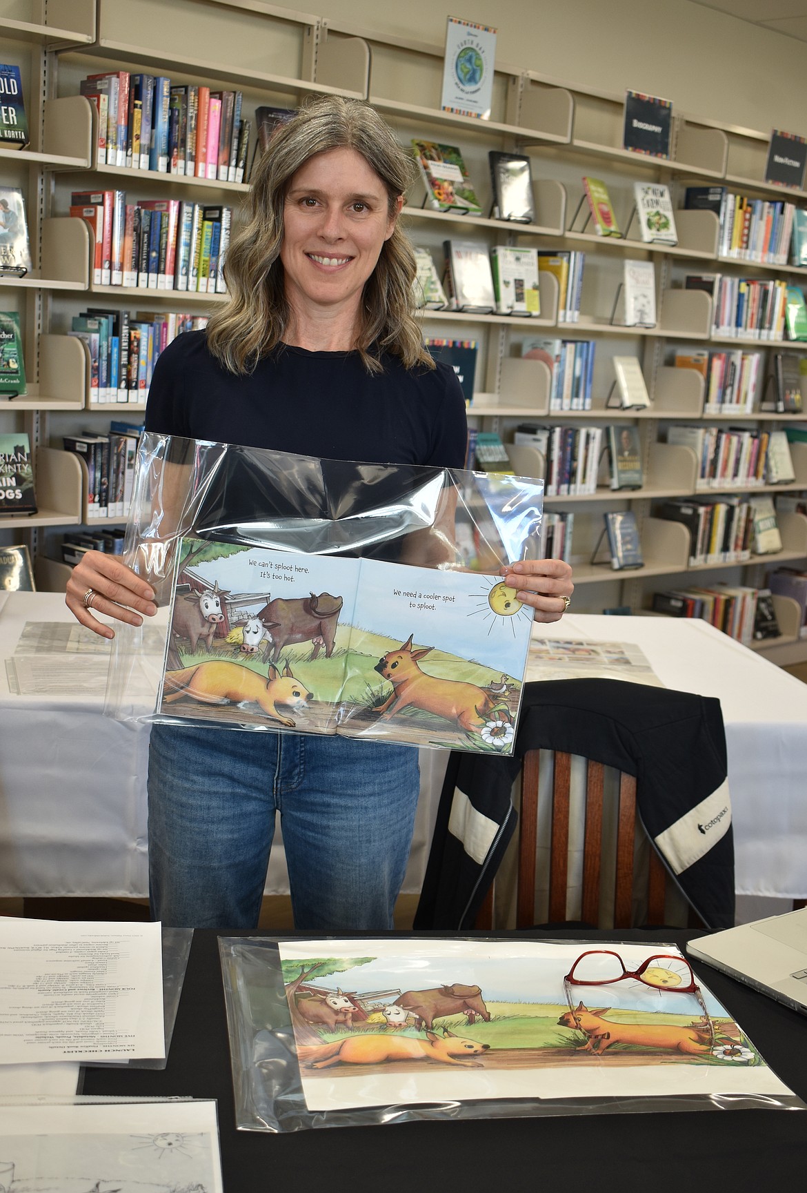 Children’s author SaDonna Heathman shows some drawings for her upcoming children’s book, entitled “Sploot!”