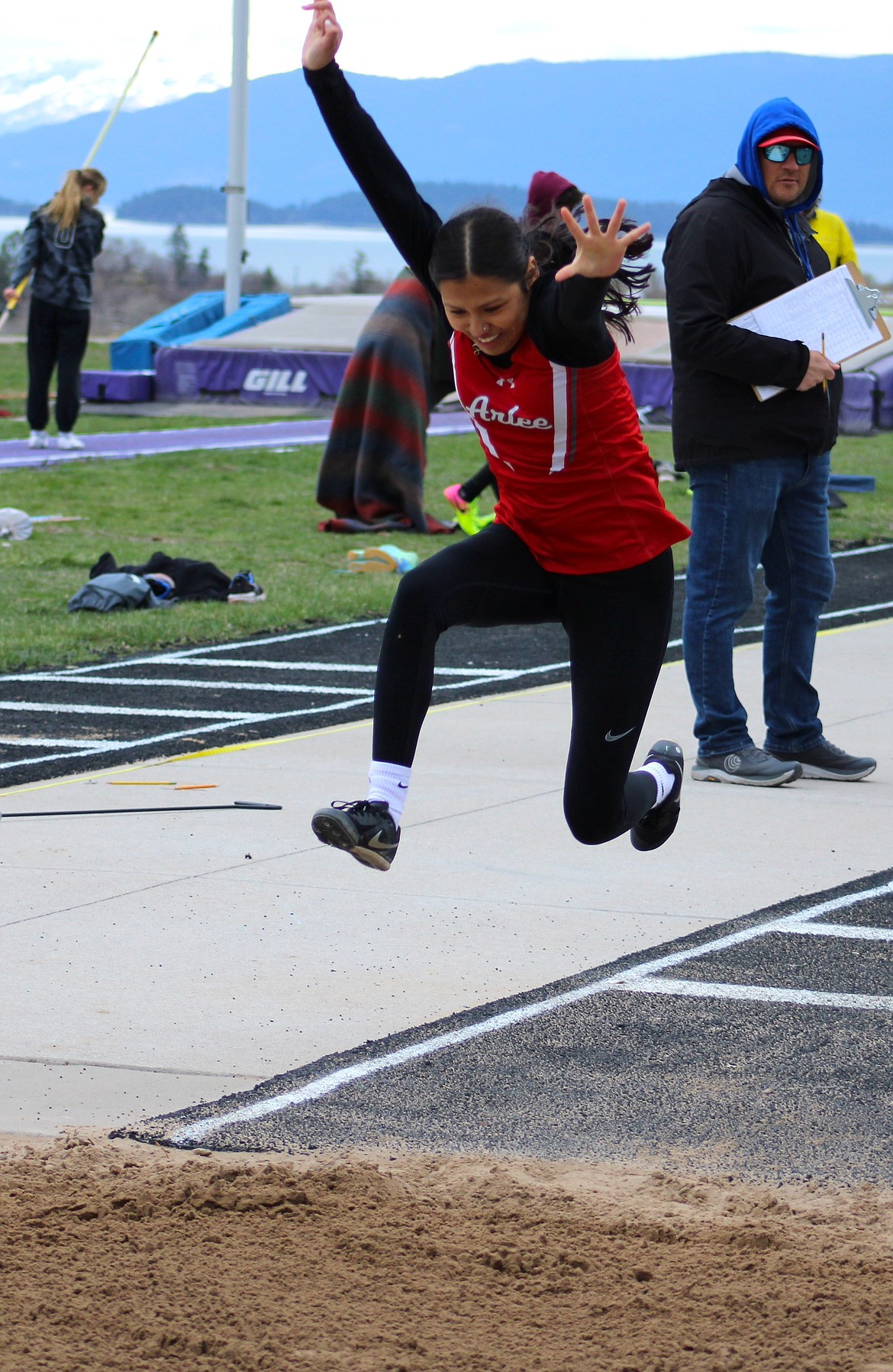 Arlee's Saiawana Haynes flies through the air in the triple jump at last Saturday's meet in Polson. (Kaleb Unger/Leader)