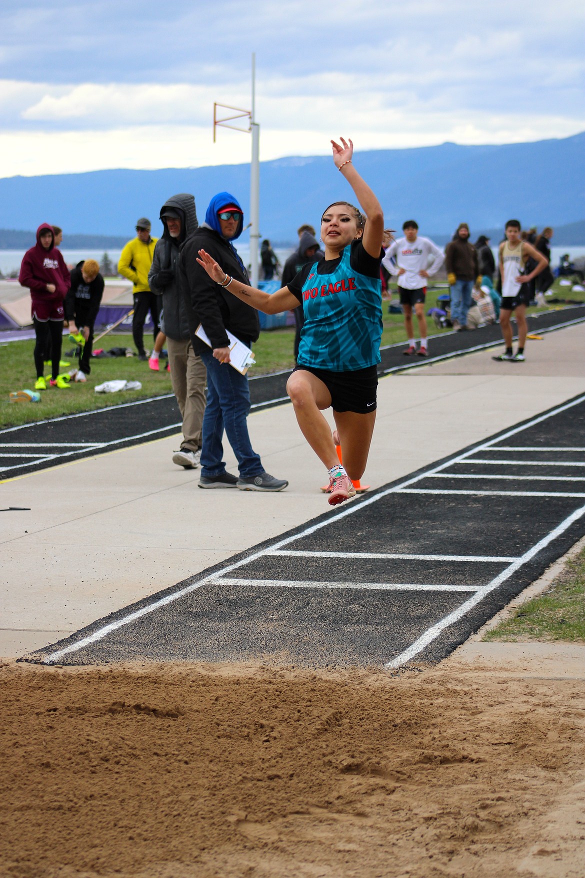 Two Eagle Sophomore Keke Tenas glides through the air during the triple jump at last Saturday's meet in Polson. (Kaleb Unger/Leader)