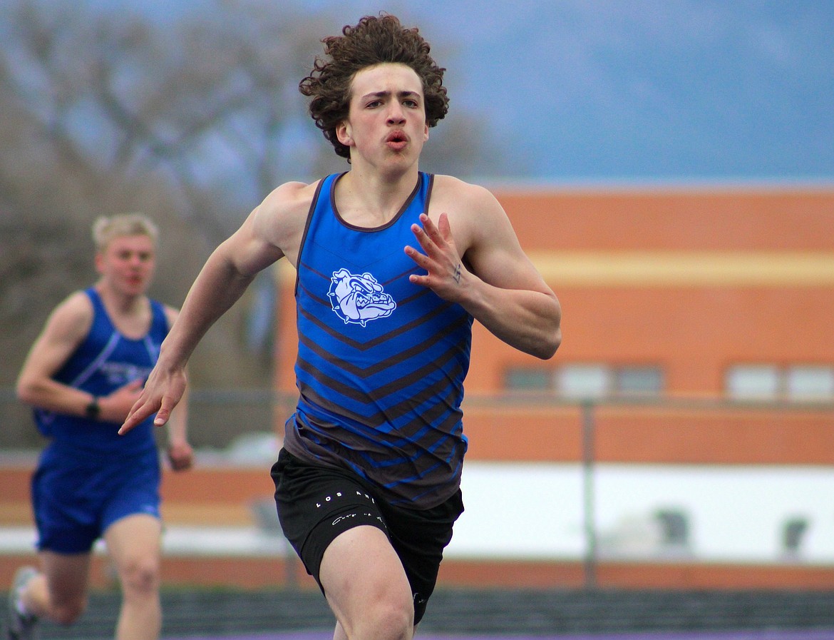 Mission's Cage Salmelin seems unfazed by the wind during the 400 meter in Polson last Saturday. (Kaleb Unger/Leader)