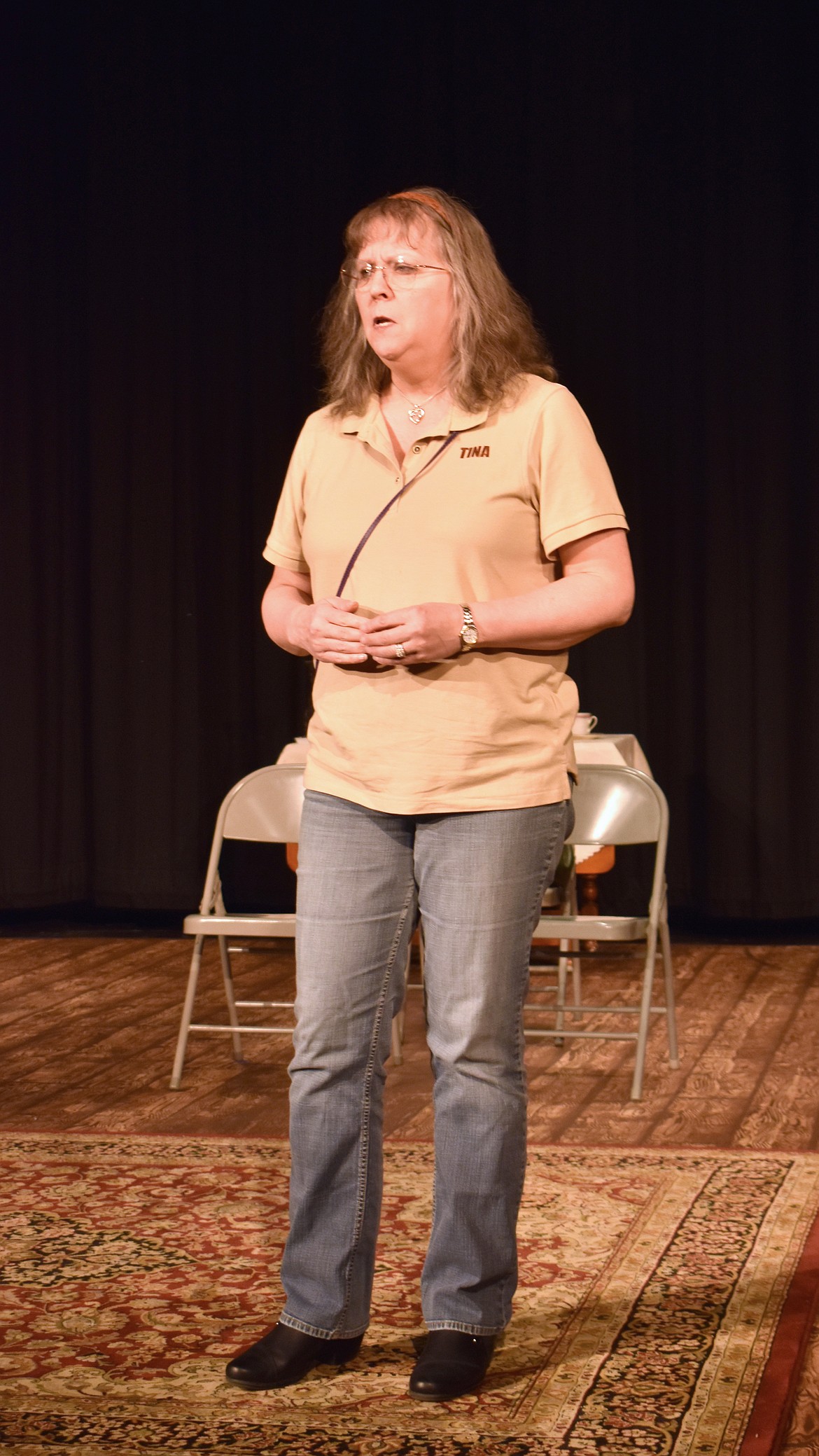 Grieving mother Jean (Tina Ferrill) struggles to remind herself that God hasn’t abandoned her at a rehearsal of “The Revlon Girl.”