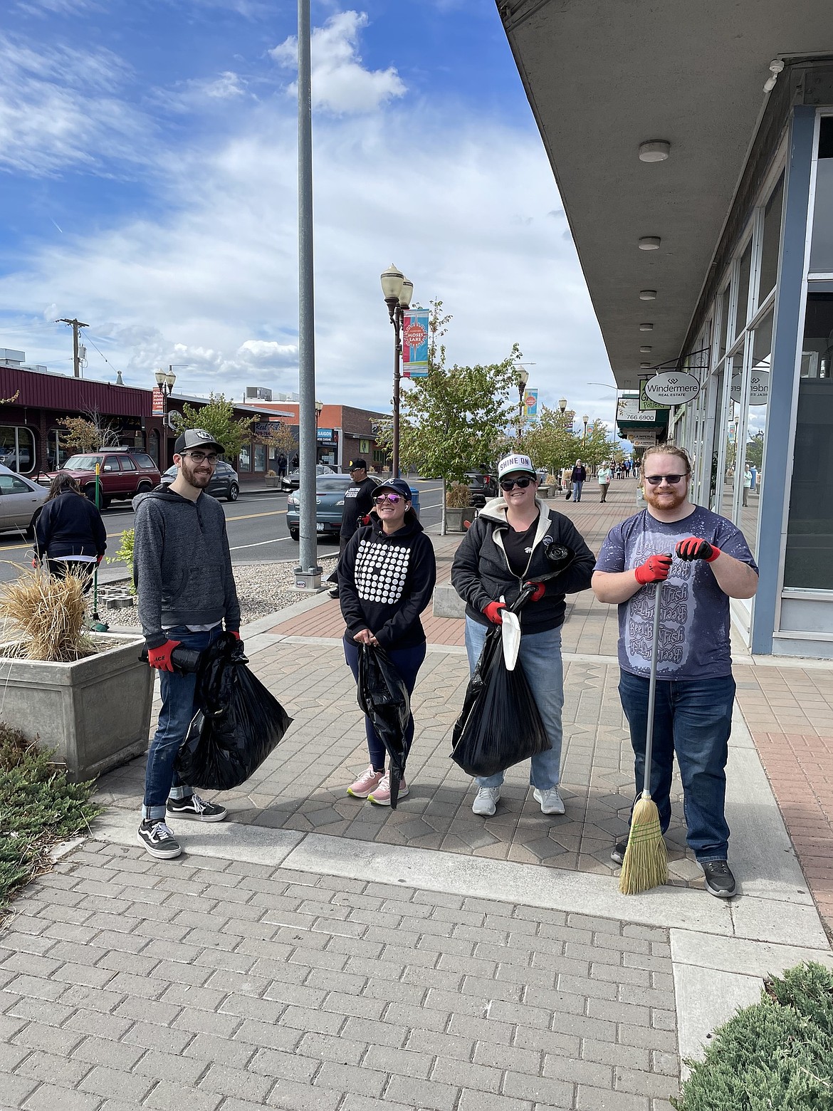Volunteers gather across the street near Artgarden Pottery and Windermere K-2 Realty in Moses Lake for last year’s downtown cleanup event. This year’s cleanup is set for April 26.