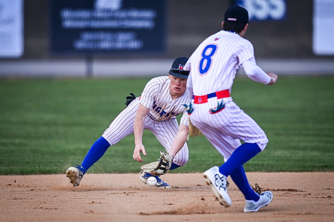 Bigfork shorstop Liam Benson (7) fields a ground ball in the hole against Troy at Flathead Beacon Field on Thursday, April 17. (Casey Kreider/Daily Inter Lake)