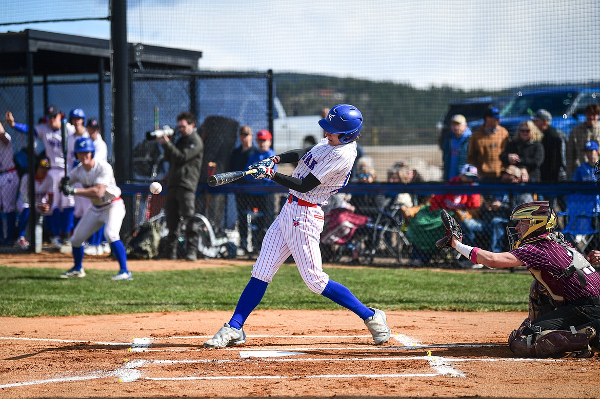 Bigfork's Cavin Wiest (16) connects on a pitch against Troy at Flathead Beacon Field on Thursday, April 17. (Casey Kreider/Daily Inter Lake)