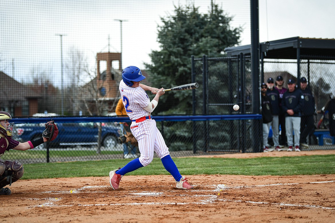 Bigfork's Sam Plummer (12) drives in a run against Troy at Flathead Beacon Field on Thursday, April 17. (Casey Kreider/Daily Inter Lake)