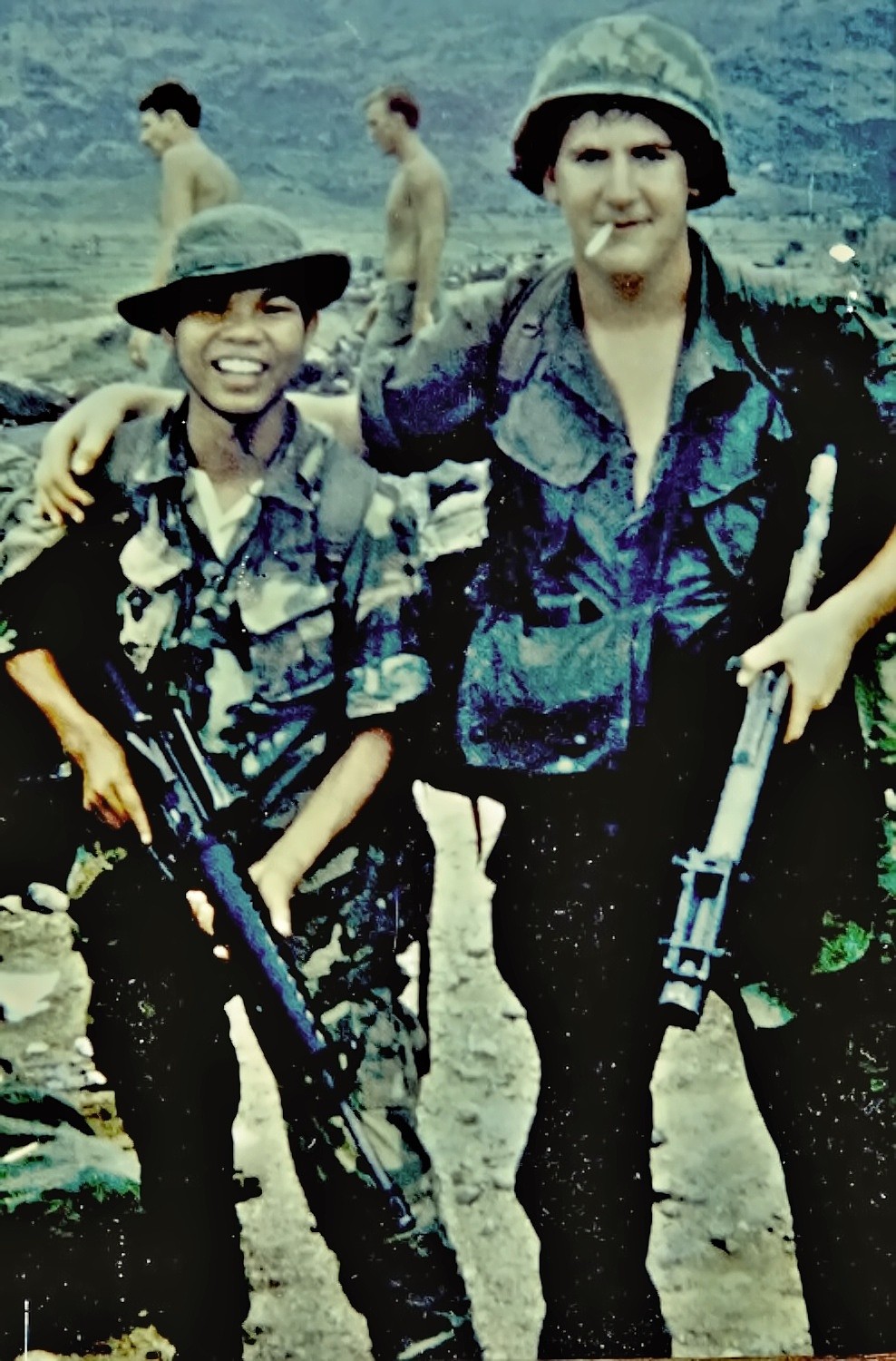 Dale Wilson stands next to Thinh, at that time only 15 years old. Thinh had switched sides to become a "Kit Carson scout" and was working with Wilson's infantry battalion. Wilson was wounded 33 days after this photo was taken.