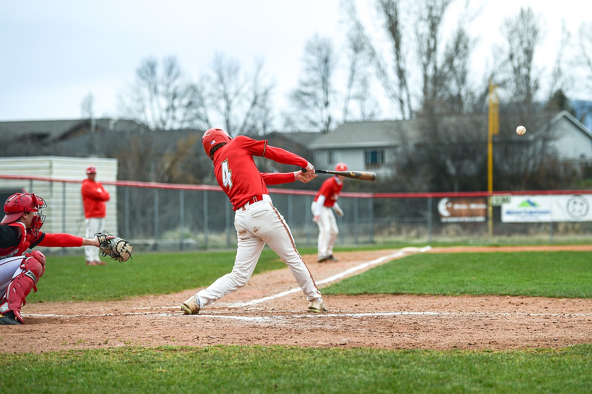 Lakers AA's Jackson Heino (4) drives in a pair of runs in the second inning against the Calgary Cardinals at Griffin Field on Saturday, April 19. (Casey Kreider/Daily Inter Lake)