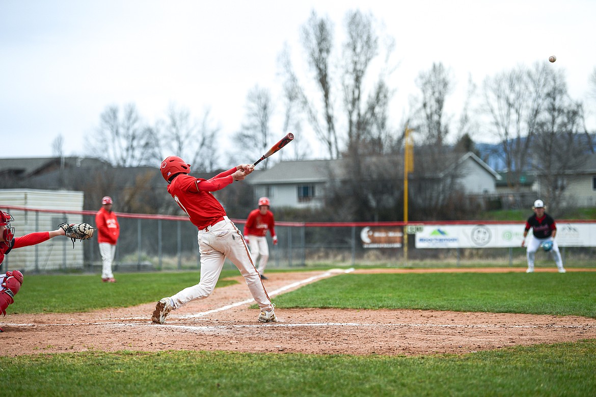 Lakers AA's Bryce Buckmaster (17) drives in a pair of runs in the second inning against the Calgary Cardinals at Griffin Field on Saturday, April 19. (Casey Kreider/Daily Inter Lake)