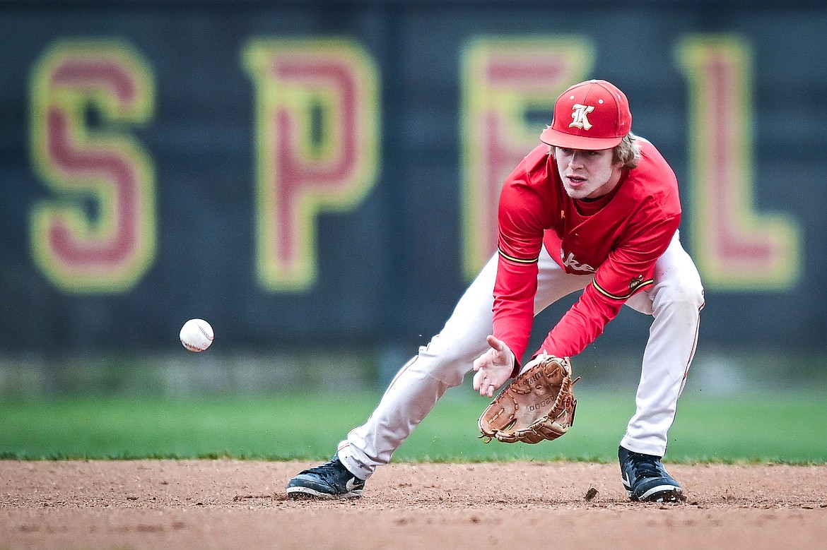 Lakers AA second baseman Hunter Fann (15) watches a ground ball into his glove in the first inning against the Calgary Cardinals at Griffin Field on Saturday, April 19. (Casey Kreider/Daily Inter Lake)