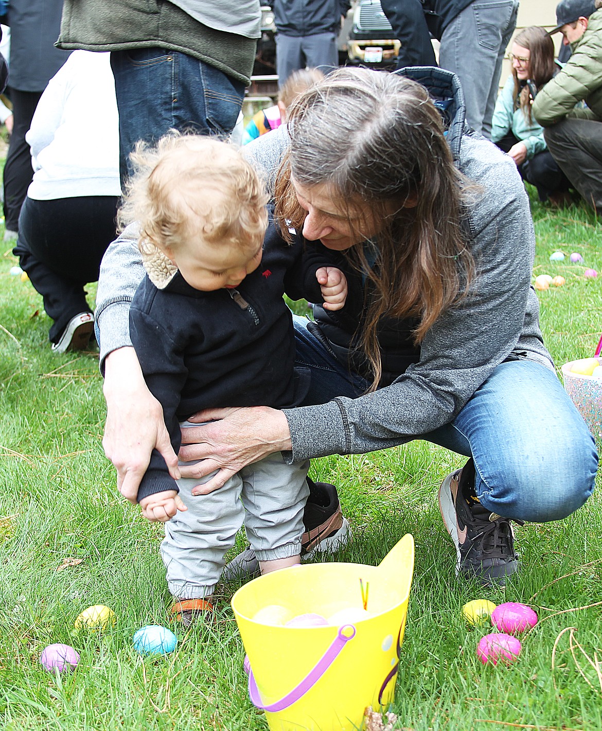 A youngster gets a hug during the Sandpoint Lions' annual Easter egg hunt Saturday at Lakeview Park.