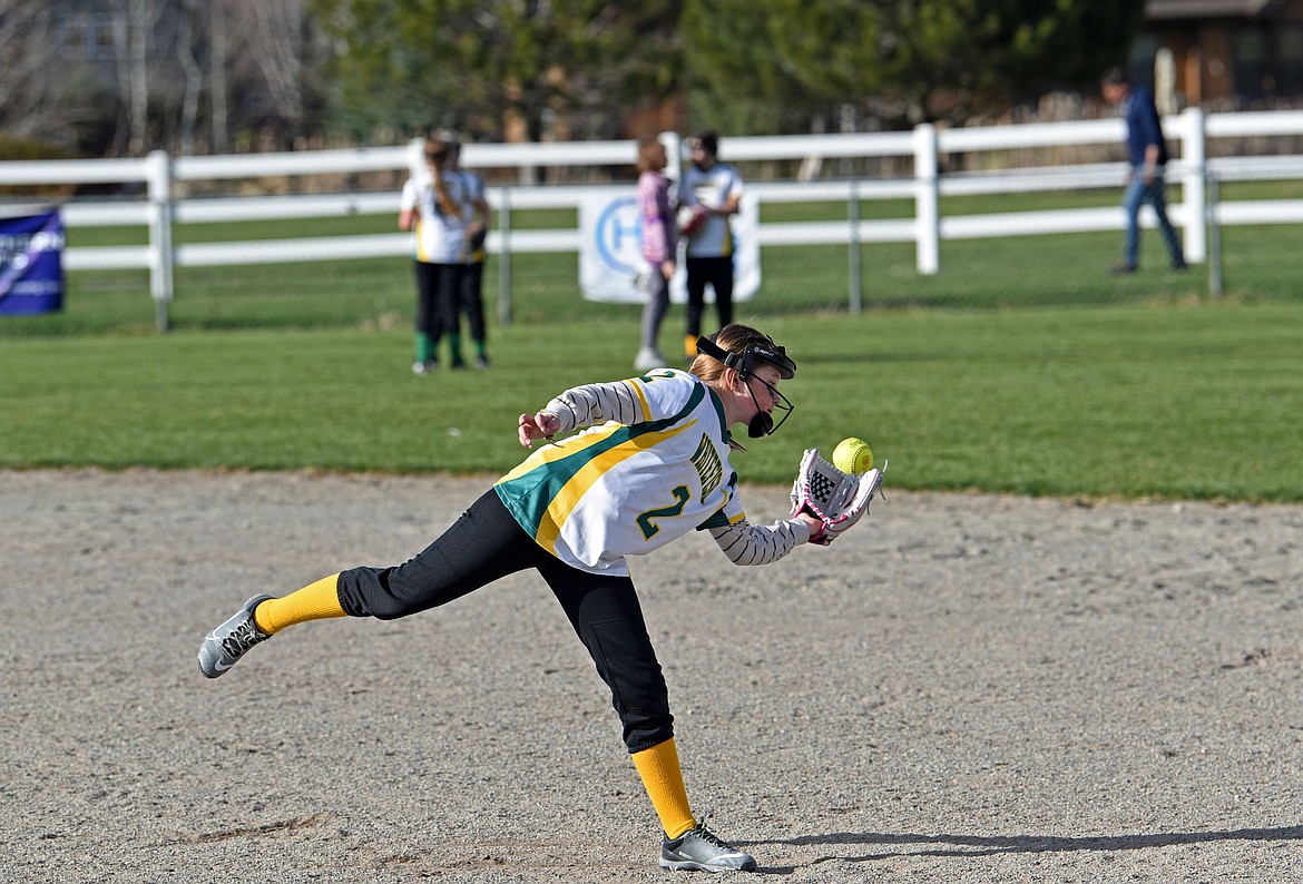 Bennet DeHan, on Whitefish Youth Softball's 10u white team, practices before a game on Tuesday, April 15. (Kelsey Evans/Whitefish Pilot)