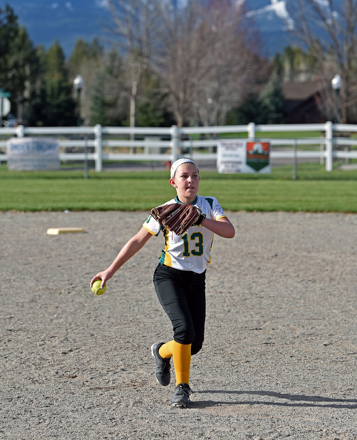 Frankie Lamb, on the Whitefish Youth Softball 10u white team, practicing at Smith Fields last week. (Kelsey Evans/Whitefish Pilot)