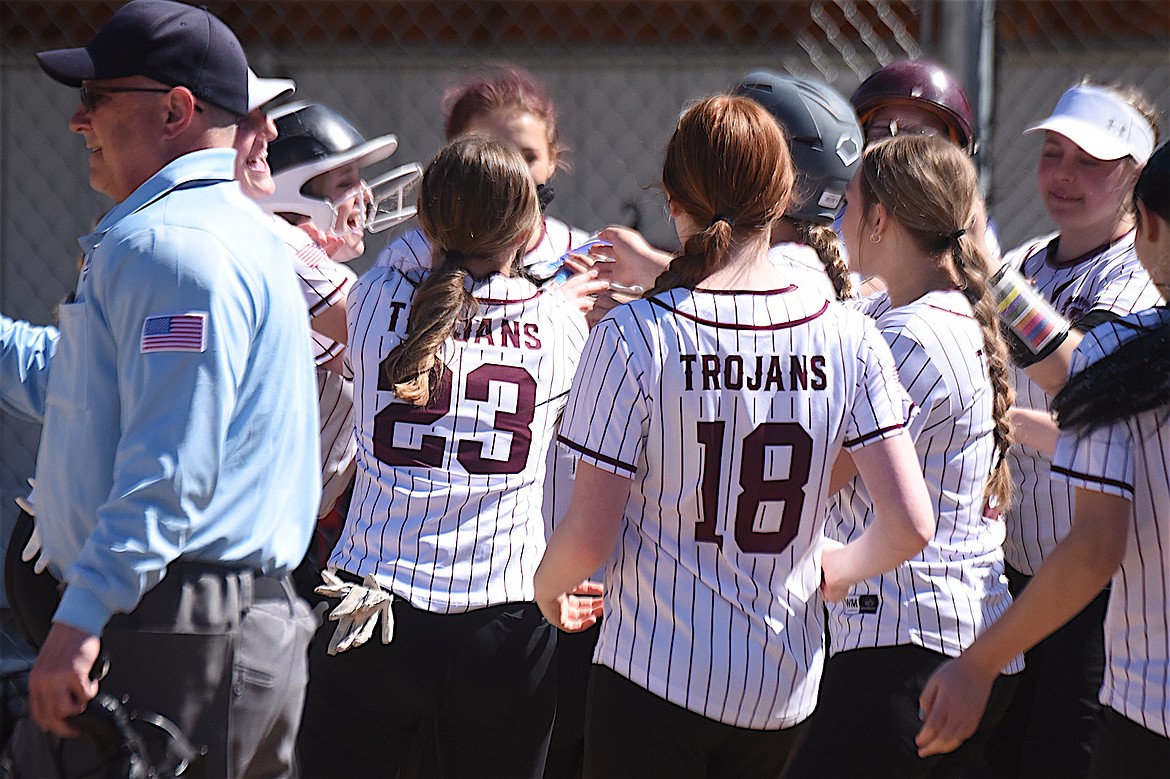 Members of the Troy High School softball team celebrate a home run hit by Leslie Gravier Friday, April 18, 2025. Troy beat Plains, 18-3 in four innings. (Scott Shindledecker/The Western News)