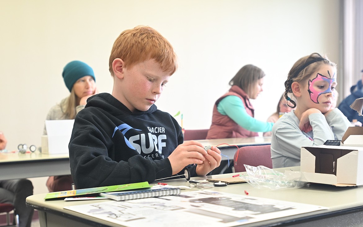 A workshop in which participants constructed their own solar-powered toy car was among Saturday's Earth Day Expo event offerings. (Hailey Smalley/Daily Inter Lake)