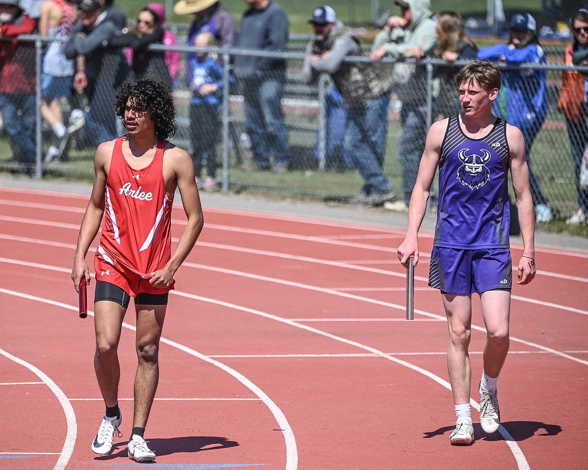 Dustone Cyrus (Arlee) and Karson Cox (Charlo) await the handoff from their relay teammates. (Christa Umphrey photo)