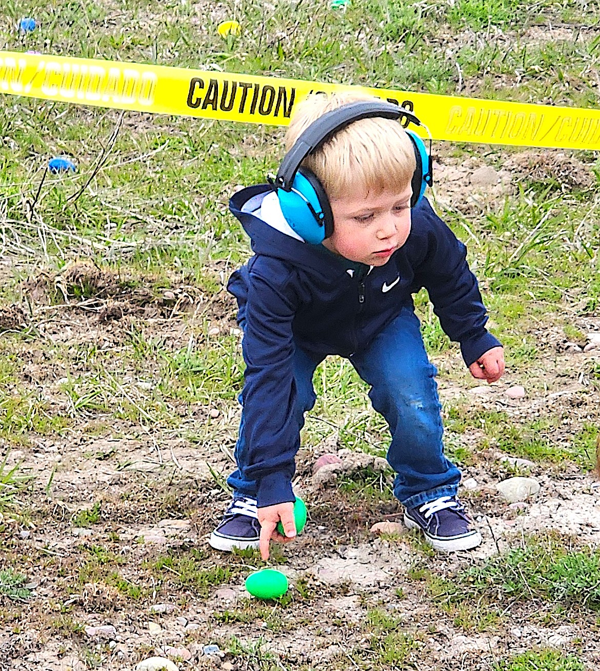This young man had two Easter eggs corralled and was looking for his next treasure. (Berl Tiskus/Leader)
