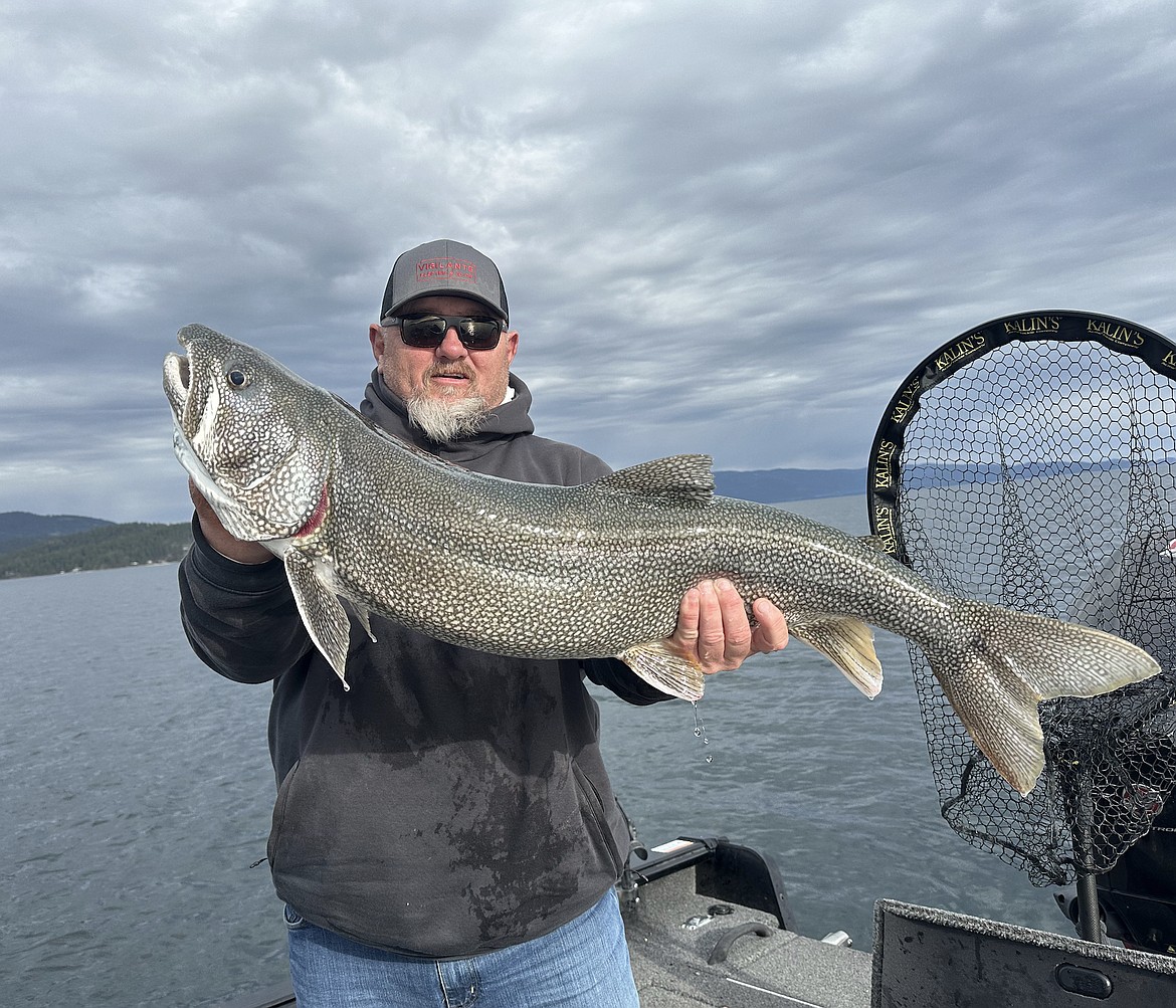 Justin Bair displays the 37-inch, 19.1-pound lake trout he caught last week during Mack Days. (Courtesy photo)