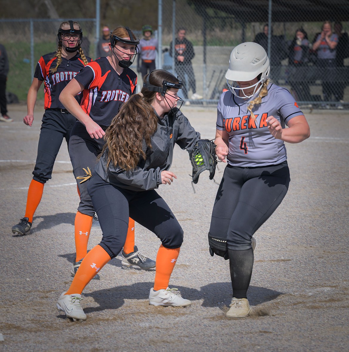 Trotters' infielder Cooper Spurr (dark coat), tags out Eureka's Marley Neesvig, who was caught off base during their game this past week in Plains. (Tracy Scott, Valley Press)