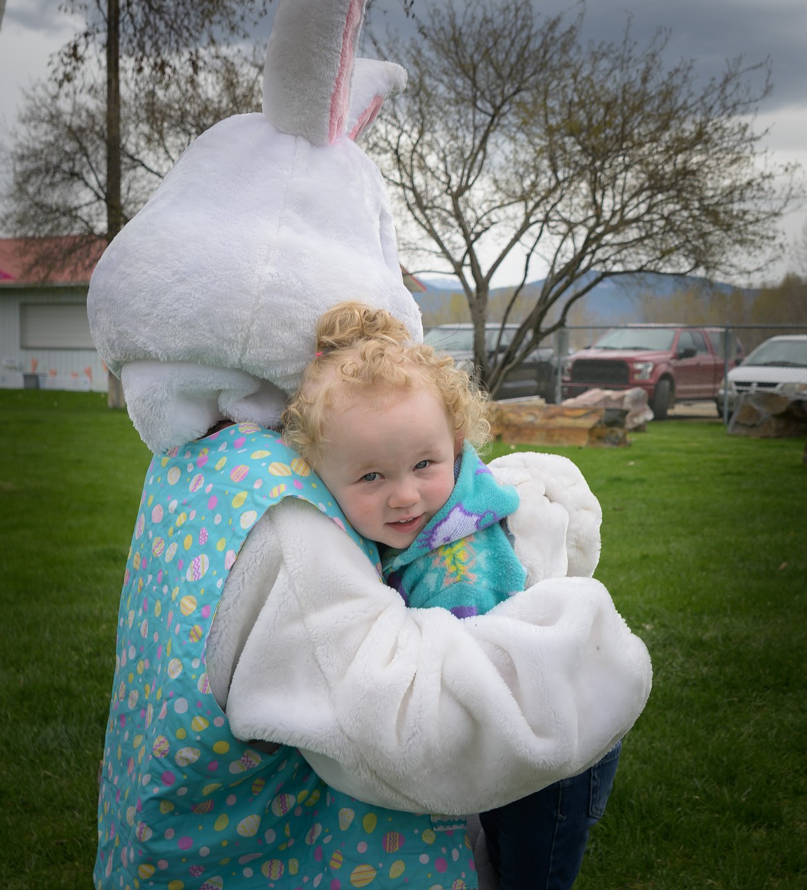 Two-year-old Ava Bruno has lots of hugs for the Easter Bunny. (Tracy Scott/Valley Press)