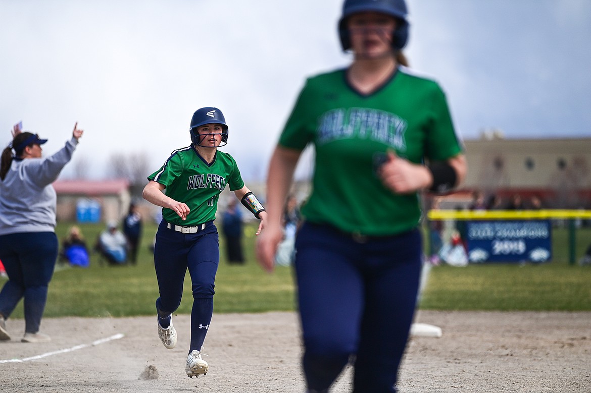 Glacier's Aubree Gerber (25) and Kaydee Walcheck (11) score on a sixth-inning single by Olivia Warriner against Butte at Glacier High School on Tuesday, April 22. (Casey Kreider/Daily Inter Lake)