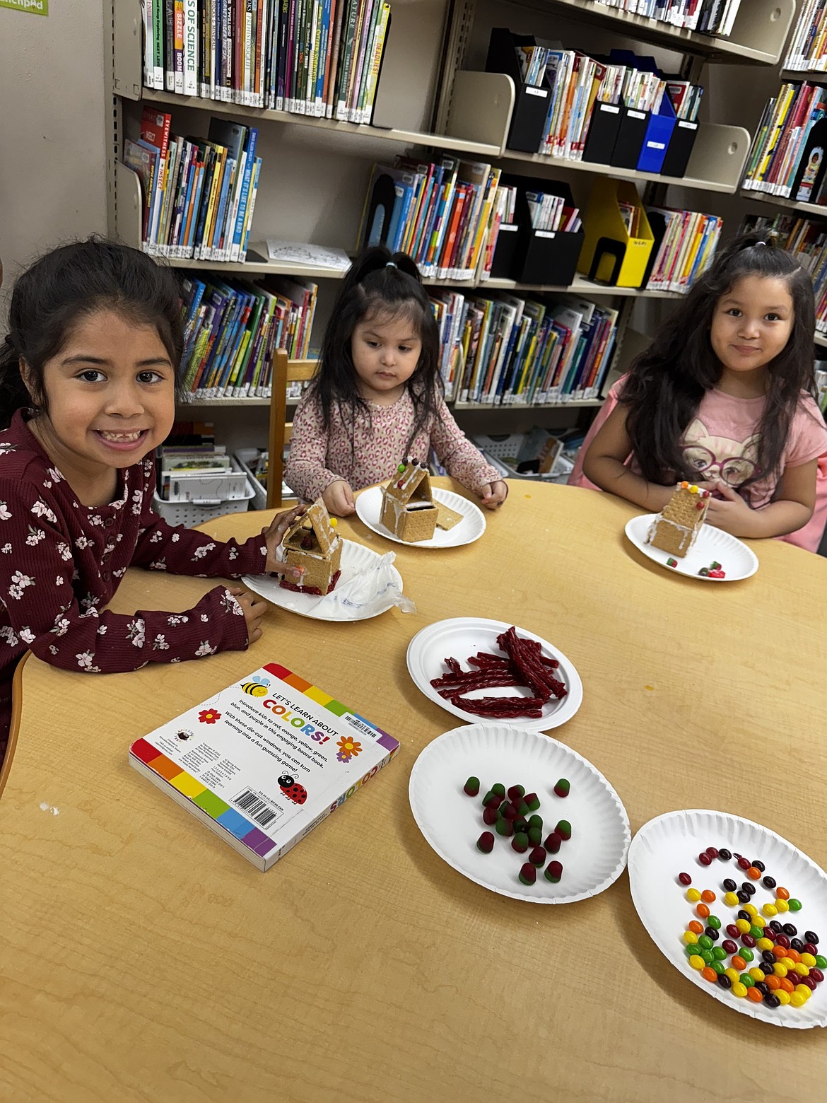 Children construct gingerbread houses at the Mattawa Public Library. North Central Washington Library officials are planning on expanding hours.