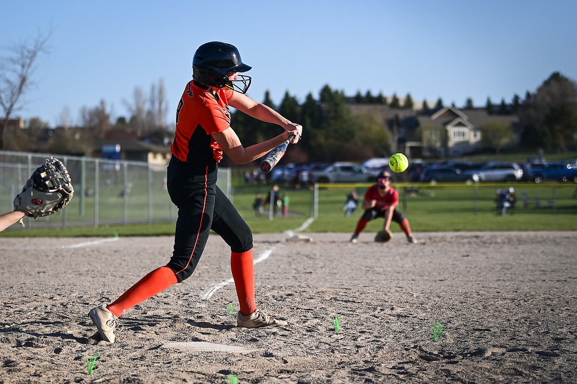 Flathead's Macey McIlhargey (3) drives in a run with an RBI single in the seventh inning against Columbia Falls at Kidsports Complex on Thursday, April 24. (Casey Kreider/Daily Inter Lake)