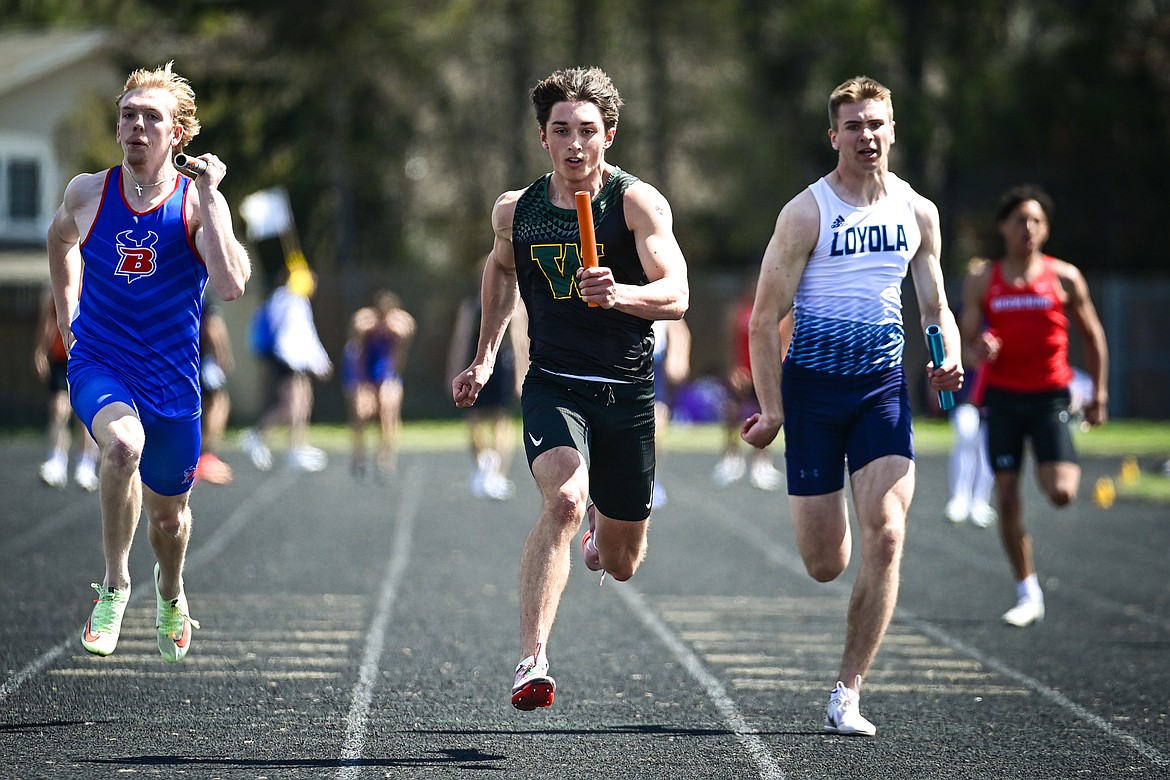 Whitefish's Riley Zetooney runs the anchor leg for the Bulldog boys' 4x100 relay team which includes Colby Minton, Scott Dalen and Ethan Amick at the Whitefish ARM Invitational on Saturday, April 26. (Casey Kreider/Daily Inter Lake)