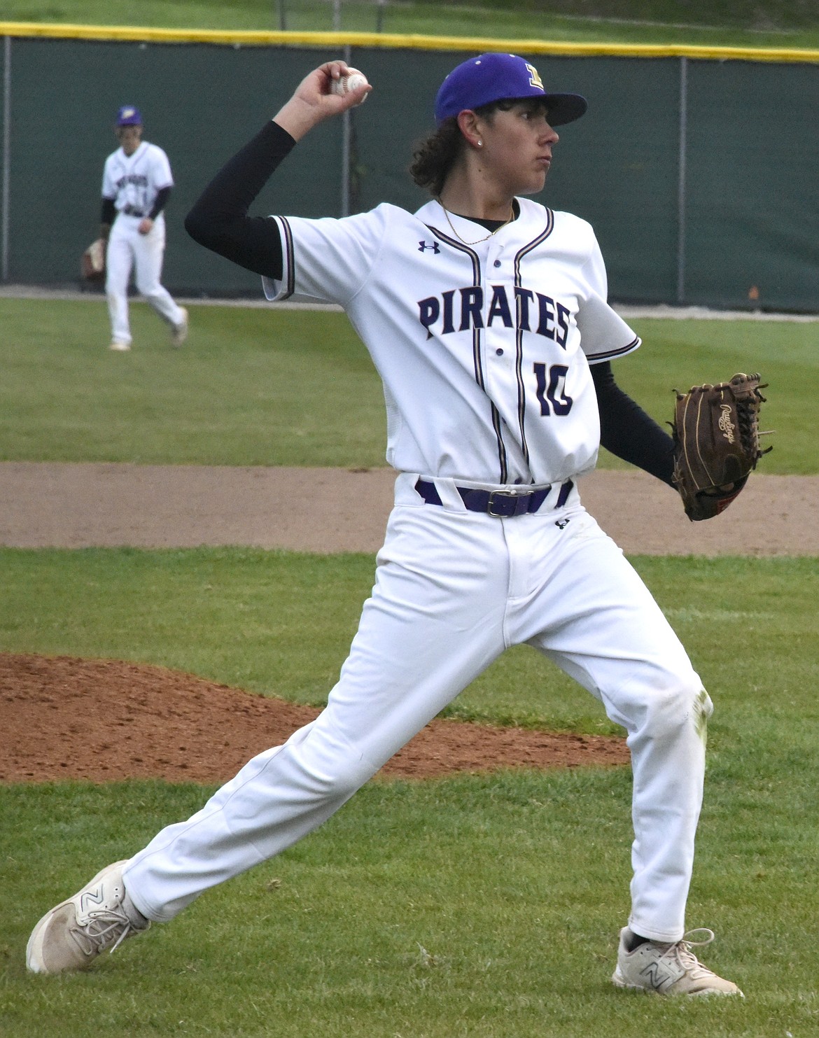 Polson pitcher Landon Pablo throws to first to attempt to get the out against Lincoln County. (Kaleb Unger/Leader)