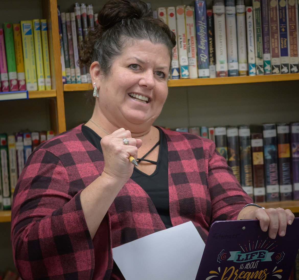 Plains High School Principal Dr. Heidii Fettinger was excited to announce the number of honor roll students during the Plains School Board meeting. (Tracy Scott/Valley Press)