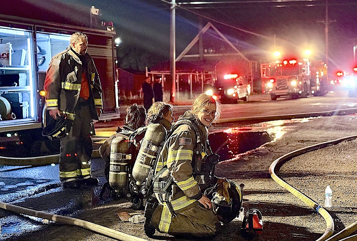 Polson volunteer firefighter Robyn Bishop is on the job at a recent house fire. (Ismet Gokce photo)