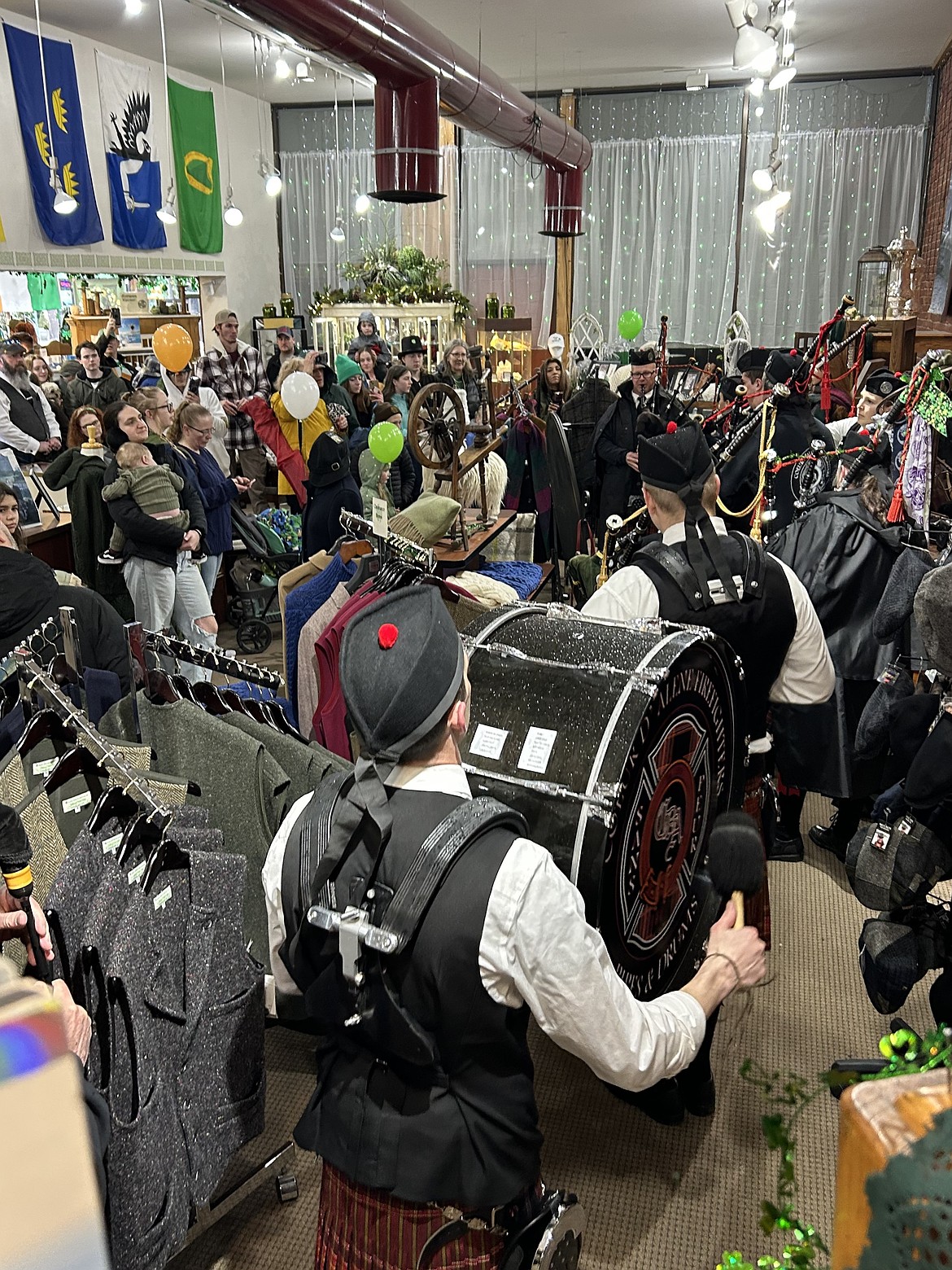 A crowd fills All Things Irish to hear the Coeur d'Alene Firefighters Pipes and Drums on St. Patrick's Day.