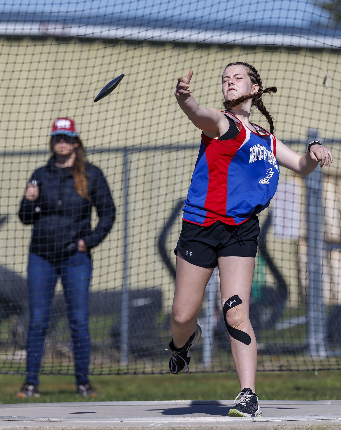 Marion Shanks throws the discus for Bigfork's middle school team.