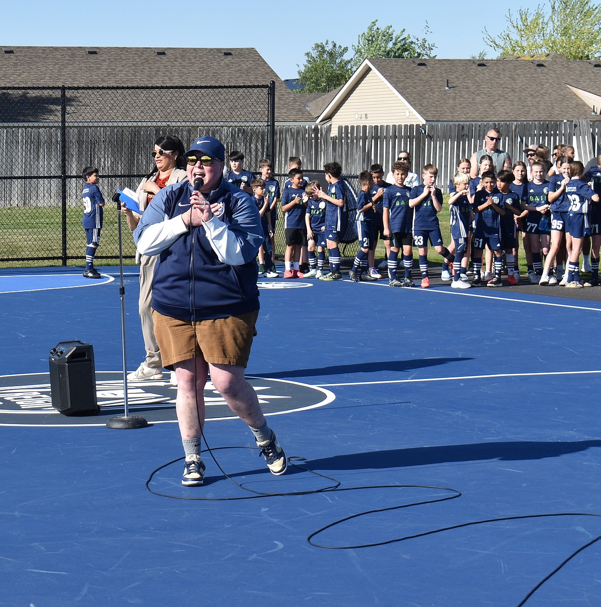 Seattle Reign Fan Development and Impact Manager Steph Hirsch addresses the attendees at the futsal mini-pitch opening Tuesday. One of the new Moses Lake mini-pitches is painted in honor of the Reign, the first of its kind in Washington, Hirsch said.