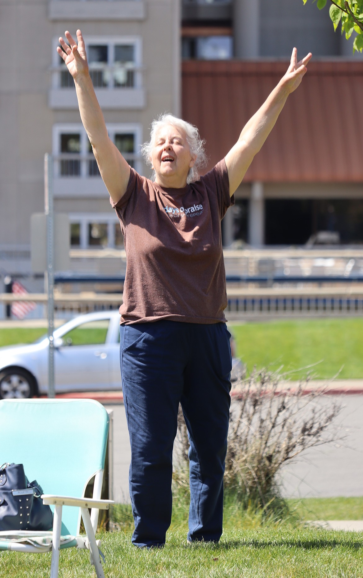 Lori Daub raises her hands in prayer during the National Day of Prayer in Coeur d'Alene.